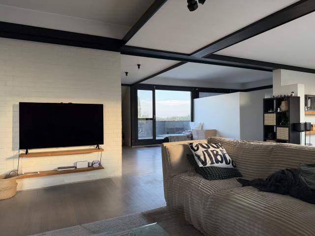 Bright modern penthouse bedroom for student rental, with shared common space, near Howest Kortrijk