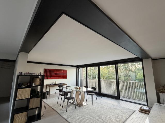Bright modern penthouse bedroom for student rental, with shared common space, near Howest Kortrijk
