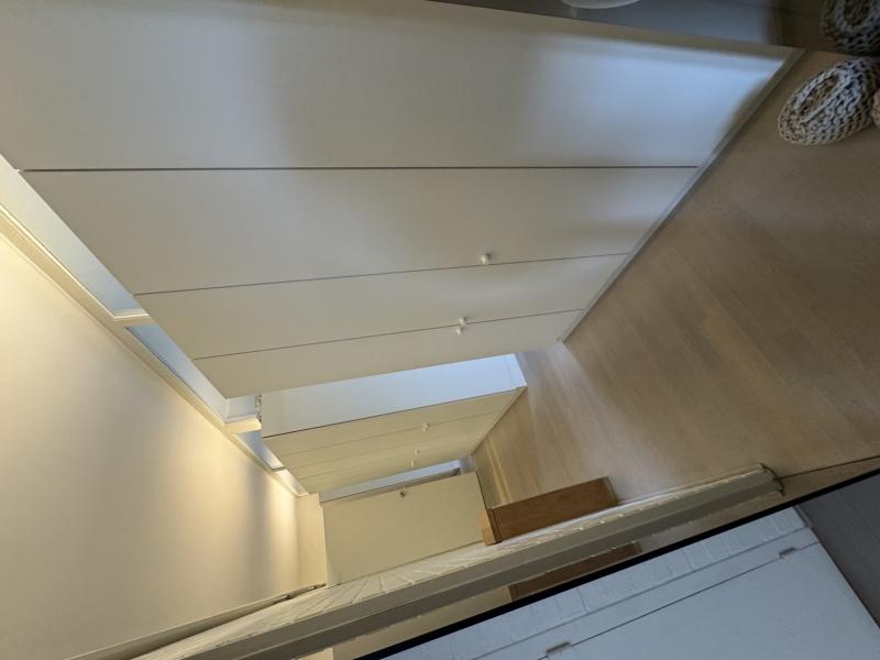 Bright modern penthouse bedroom for student rental, with shared common space, near Howest Kortrijk