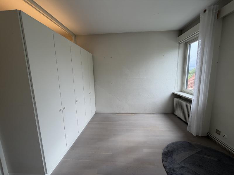 Bright modern penthouse bedroom for student rental, with shared common space, near Howest Kortrijk
