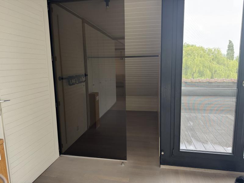 Bright modern penthouse bedroom for student rental, with shared common space, near Howest Kortrijk