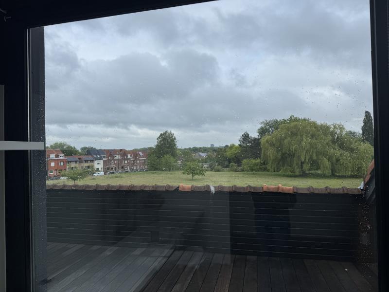 Bright modern penthouse bedroom for student rental, with shared common space, near Howest Kortrijk